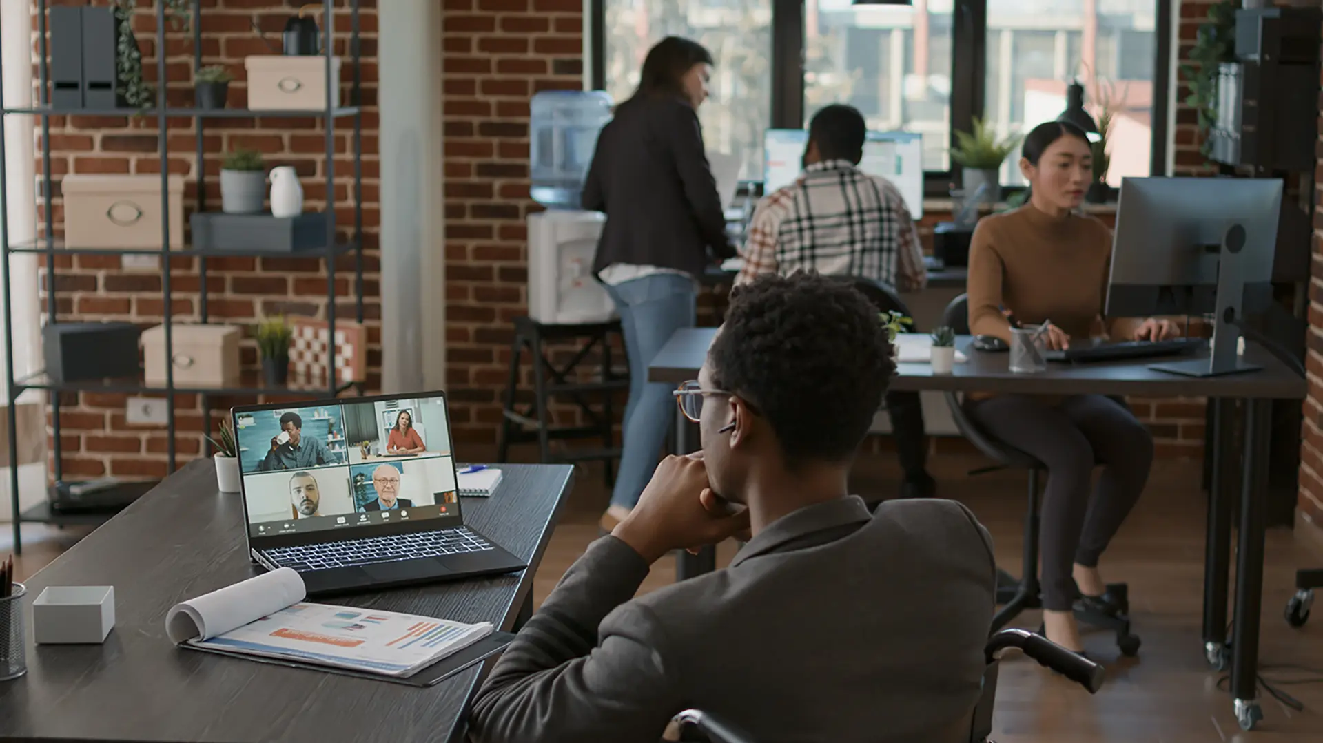 young-man-talking-businesspeople-online-teleconference-using-remote-videocall-meeting-discuss-financial-strategy-company-employee-with-disability-working-videoconference